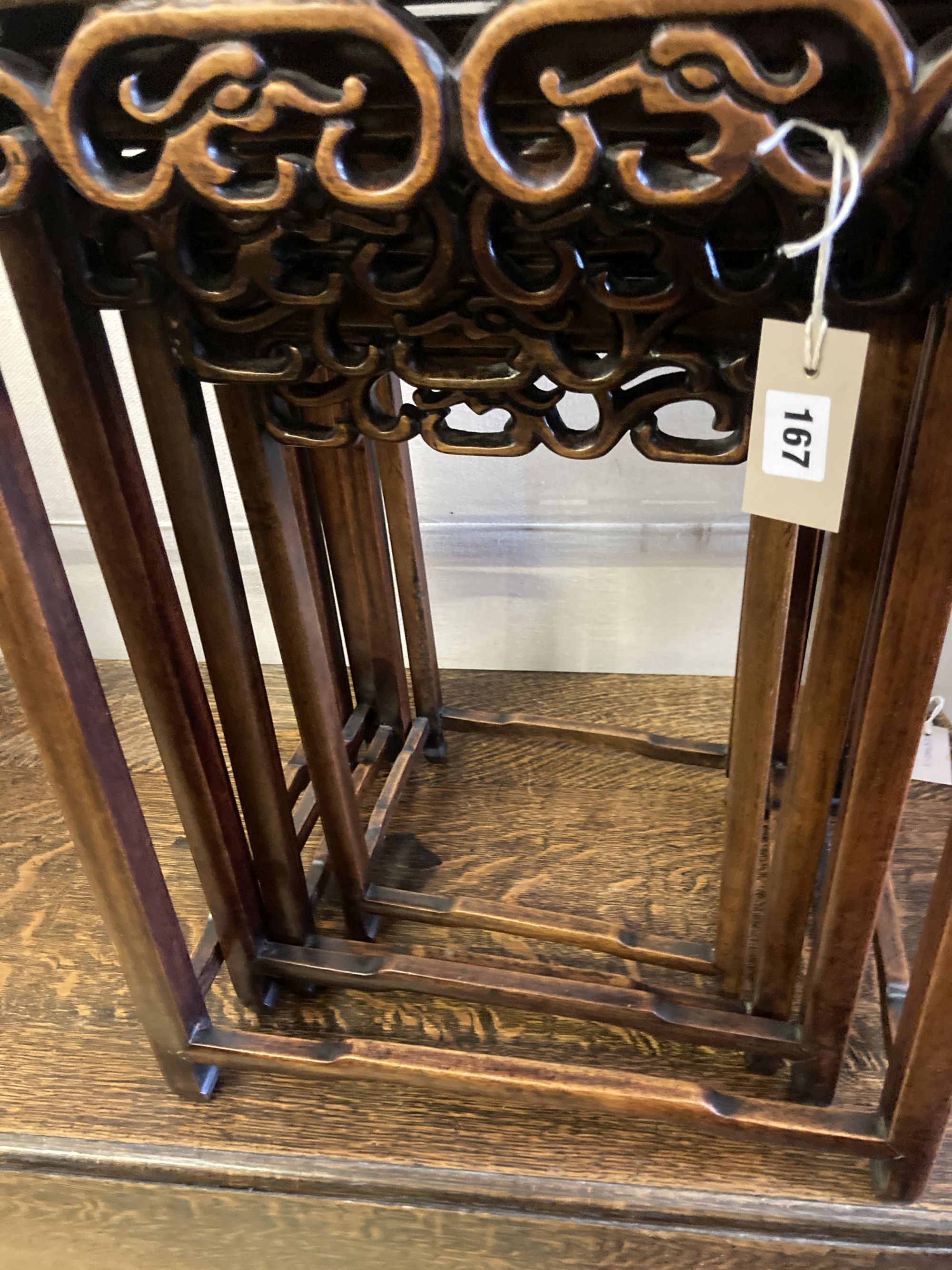 A nest of four Chinese carved hardwood tea tables, width 44cm, depth 33cm, height 62cm